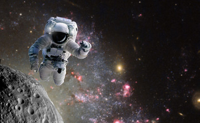 Naklejka premium Concept of conquering the universe by the human race. Elements of this image furnished by NASA
