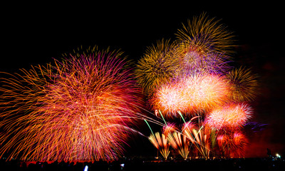 Landscape of Chiba city fireworks event in the background of Tokyo city light in the summer night