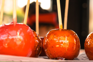 glazed apple red focus on the central fruit close-up design festival celebration child sweetness