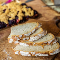 Slices of bread on a wooden board.