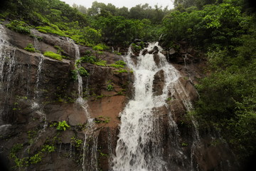 Waterfall mountain with rain clouds view