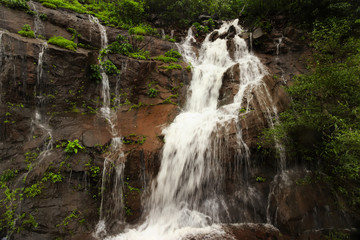 Waterfall mountain with rain clouds view