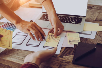 Web designer meeting  planning application for mobile phone. Design Online Technology Content,...