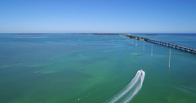 Aerial Panning View of a Boat Speeding through the Florida Keys