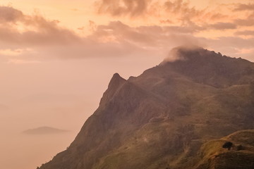 Mountain view misty morning of Peak mountain around with soft fog, sunrise at Pha Tang, Chiang Rai, northern of Thailand.