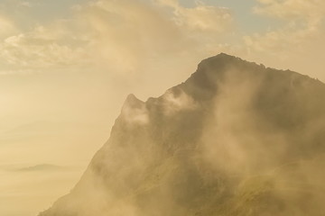 Mountain view misty morning of Peak mountain around with soft fog, sunrise at Pha Tang, Chiang Rai, northern of Thailand.