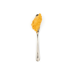 brown peanut butter on spoon