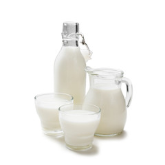 Jug,bottle and glasses of fresh milk isolated on white background. 