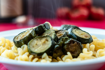 Italian food: pasta with zucchini and parmesan