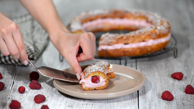 Paris-Brest choux pastry cake with whipped cream and berries. Close up. French dessert
