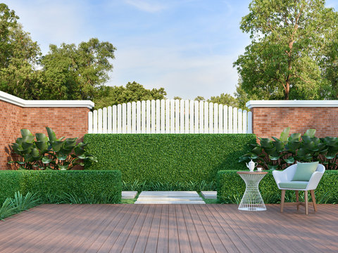 White chair in the green garden 3d render,  There are a wooden floor terrace,white wood plank and orange brick wall fence,decorated with white weave chair and green fabric pillow.
