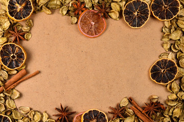 Autumn background with golden leaves, dried fruts, cinnamon and anis. Space for text or design.