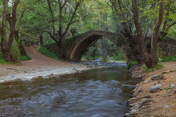 Fototapeta na wymiar Tzelefos bridge, also known as Kelefos. Paphos District, Cyprus. Long exposure.