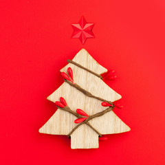Christmas card background. Xmas tree with star concept on red background
