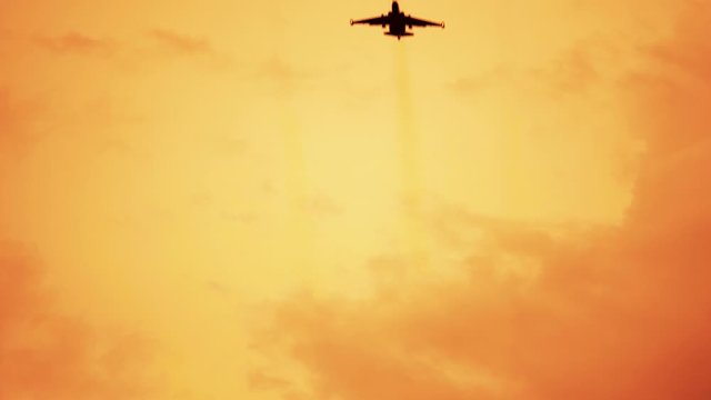 Armed russian fighter jets on the red sunset background