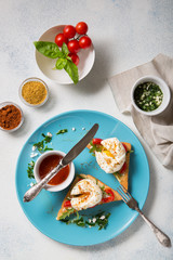 A traditional dish of French cuisine. Poached eggs with spices on a light background Top view