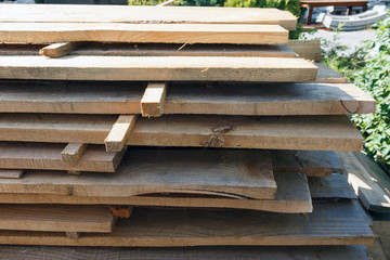 rough wood on the construction site in sunny weather. eco friendly natural wooden planks for construction works