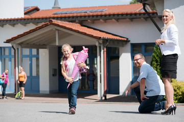 Little girl getting out of school after her first day