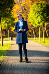 Obraz premium Middle-aged woman walking in city park