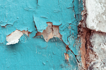Texture of cracked blue and brown wall background.
