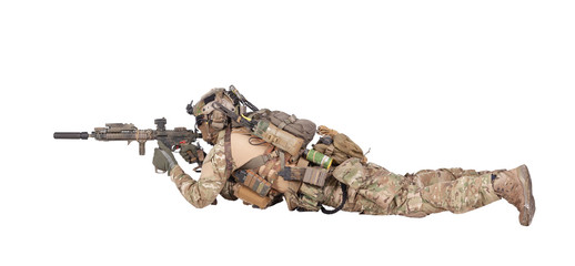 Soldier shooting from ground isolated studio shoot