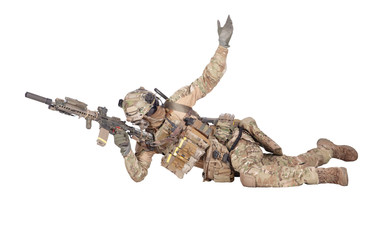 Fototapeta premium Soldier shooting from ground isolated studio shoot