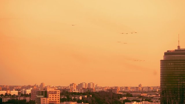 Armed russian fighter jets on the red sunset background