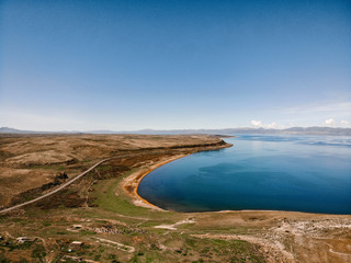 Beautiful view of Sevan lake with turquoise water and green hills, Sevan, Armenia