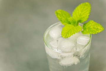 Delicious cold drink. Glass with ice cubes. Fresh icy cold cool freshening liquid. Beautiful...