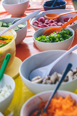 healthy outdoor meal, table with various vegetables and salads