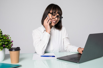 Successful business woman talking on the smart phone at meeting room.