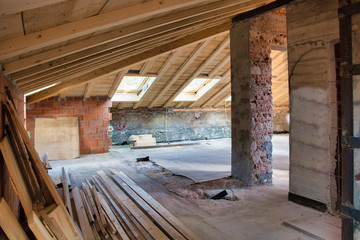 Masonry house with wooden roof under renovation