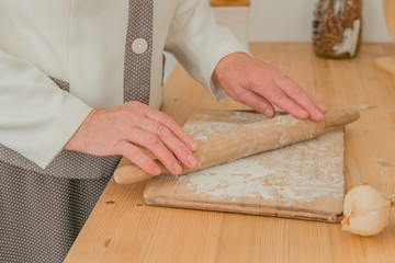 caring kind grandmother prepares pies for her family © Маргарита Семенчуков