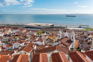 View over the roofs of the Alfama district to the Tagus river and the cruise terminal in Lisbon