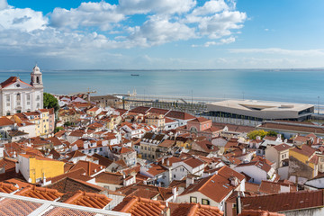 View over the roofs of the Alfama district to the Tagus river and the cruise terminal in Lisbon