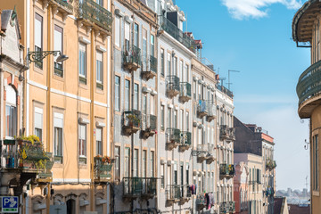 Row of houses in a typical Portuguese style with glazed tiles up on the hillside of the Graça district of Lisbon