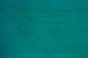 Fototapeta premium An old painted green surface is the background.