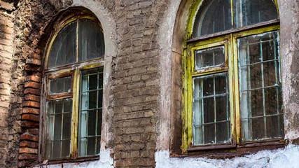 Fototapeta na wymiar Wooden vintage windows with internal iron bars.