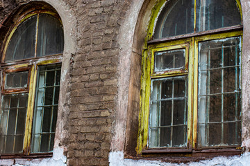 Wooden vintage windows with internal iron bars.
