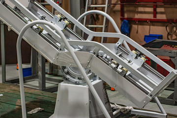 The frame of a mechanical chair with automatic tilt.