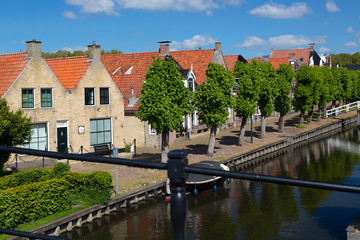 Fototapeta na wymiar Canal in historic Dutch town Sloten, Friesland