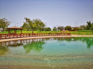 Fototapeta premium sitting places in a park next to a lake garden recreation facility 