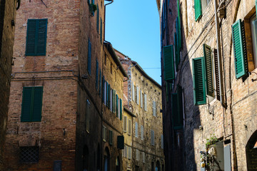 Medieval street in Siena city center, Italy