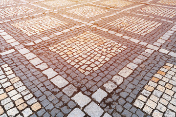 Old paving stones pattern. Texture of ancient german cobblestone in city downtown. Little granite...