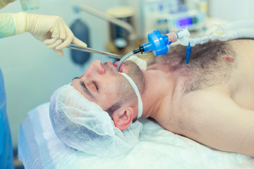 Operating room. Preparation of the patient for rhinoplasty. Treatment of persons with a...
