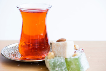 Traditional turkish delight and cup of tea.