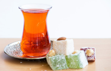 Traditional turkish delight and cup of tea.