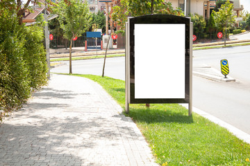advertising board on asphalt road