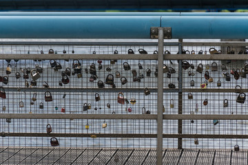 Romantic Padlocks with the name of the couple attached to a bridge representing the durability of their eternal love.