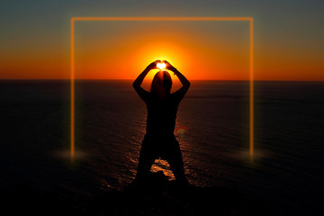 Fototapeta premium Girl on the ocean at sunset. Luminous frame. Frame and mock up